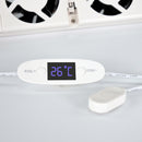 White electronic device with digital temperature display on a light gray background