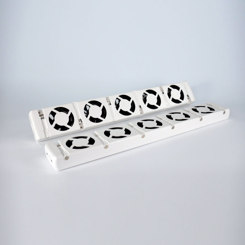 Two white booster fans with black blades on a light grey background
