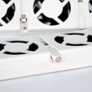 Close-up of a white metal vent with black grilles on a light gray background