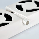 Close-up of a white metal grate with circular cutouts on a light gray background